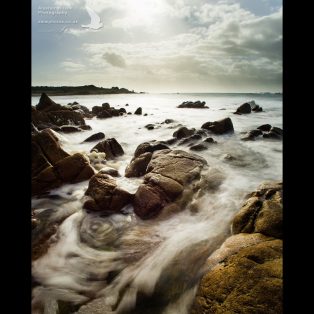 Rocky shore and gushing water